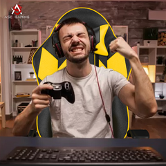 Person enjoying gaming in a Gaming Chair Yellow and Black while holding a controller and wearing headphones